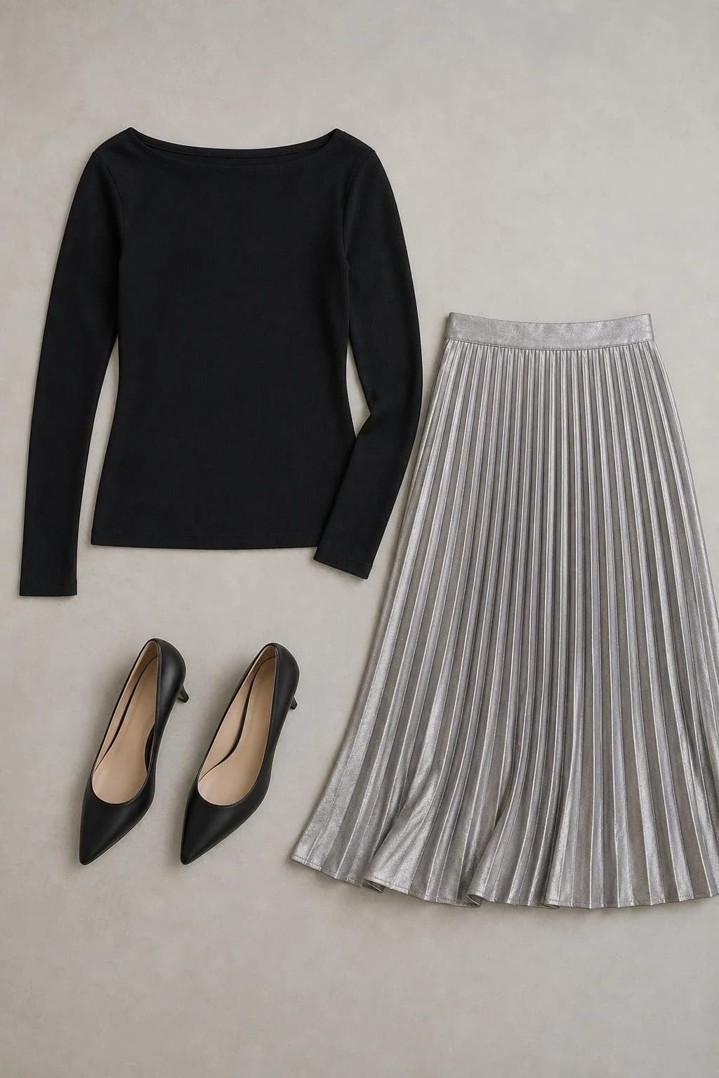 Black knit top, silver pleated skirt and heels