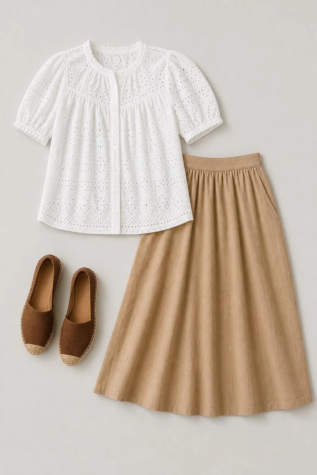 Opaque-lined white eyelet blouse, tan midi skirt and brown espadrilles